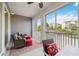 Spacious screened balcony with seating and outdoor dining at 383 Aruba Cir # 101, Bradenton, FL 34209