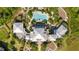 Top-down view of a community clubhouse featuring a pool and patio area at 383 Aruba Cir # 101, Bradenton, FL 34209