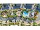 Resort-style pool with surrounding patio and landscaping in a community at 383 Aruba Cir # 101, Bradenton, FL 34209