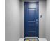 Blue front door with keypad entry and a welcome mat at 383 Aruba Cir # 101, Bradenton, FL 34209