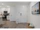 Bright entryway with kitchen and white door at 383 Aruba Cir # 101, Bradenton, FL 34209