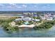Bird's-eye view of community, pool, and waterfront access at 383 Aruba Cir # 101, Bradenton, FL 34209