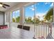 Peaceful screened balcony with seating and outdoor dining at 383 Aruba Cir # 101, Bradenton, FL 34209