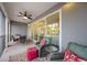 Comfortable screened balcony with seating and outdoor dining at 383 Aruba Cir # 101, Bradenton, FL 34209