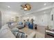 Open concept living room with sofas, hardwood floors, and view to kitchen at 383 Aruba Cir # 101, Bradenton, FL 34209