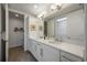 Double vanity bathroom with white cabinets and quartz countertops at 383 Aruba Cir # 101, Bradenton, FL 34209