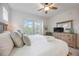 Relaxing main bedroom with king bed, dresser, and large windows at 383 Aruba Cir # 101, Bradenton, FL 34209