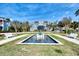 Attractive fountain and landscaping in front of a waterfront building at 383 Aruba Cir # 101, Bradenton, FL 34209