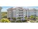 Three-story building with light gray exterior and white trim at 383 Aruba Cir # 101, Bradenton, FL 34209