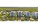 Community view with lush landscaping and a pool at 383 Aruba Cir # 101, Bradenton, FL 34209