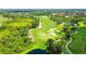 Aerial view of a section of the Lakewoods Ranch Golf course, showing lush fairways, sand traps, and natural landscaping at 7049 Whitemarsh Cir, Lakewood Ranch, FL 34202