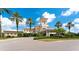 Exterior view of the clubhouse with palm trees at 7049 Whitemarsh Cir, Lakewood Ranch, FL 34202