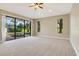 Gathering room with view of pool and sliding glass doors at 235 Dahlia Ct, Bradenton, FL 34212