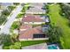 Aerial view of a house with a pool in a residential neighborhood at 235 Dahlia Ct, Bradenton, FL 34212