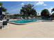 Inviting community pool area with comfortable seating and umbrellas at 6812 11Th W Ave # 6812, Bradenton, FL 34209