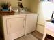 Laundry room with washer, dryer, and utility sink at 6812 11Th W Ave # 6812, Bradenton, FL 34209