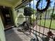 Front entry with wrought iron gate and landscaping at 6812 11Th W Ave # 6812, Bradenton, FL 34209