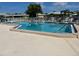 Community pool with plenty of lounge chairs and seating at 6812 11Th W Ave # 6812, Bradenton, FL 34209