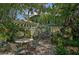 Landscaped backyard with patio furniture and a view of the house at 1663 4Th St, Sarasota, FL 34236