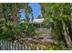 Charming bungalow with lush landscaping and white picket fence at 1663 4Th St, Sarasota, FL 34236