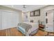 Serene bedroom with hardwood floors, a comfortable bed and built-in closet at 1663 4Th St, Sarasota, FL 34236