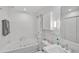Clean bathroom with a large bathtub, shower, and updated fixtures at 1663 4Th St, Sarasota, FL 34236