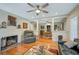 Living room with hardwood floors, fireplace, and built-in shelving at 1663 4Th St, Sarasota, FL 34236