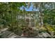 Lush tropical garden with ornate gazebo and various plants at 1663 4Th St, Sarasota, FL 34236