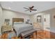 Spacious bedroom with hardwood floors, a comfortable bed, and access to a bathroom at 1663 4Th St, Sarasota, FL 34236
