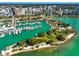Aerial view of a marina and city skyline with boats and waterfront property at 1663 4Th St, Sarasota, FL 34236