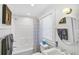 Updated bathroom with shower/tub combo and white subway tile at 1663 4Th St, Sarasota, FL 34236