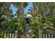 Welcoming front entry with lush tropical landscaping at 1663 4Th St, Sarasota, FL 34236