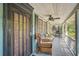 Relaxing front porch with wicker furniture at 1663 4Th St, Sarasota, FL 34236