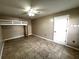 Bedroom with tile floors, ceiling fan, and a built-in bunk bed at 4601 36Th W Ave, Bradenton, FL 34209