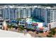 Aerial view of modern building with pool and city views at 111 S Pineapple Ave # 1009, Sarasota, FL 34236