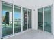 Private balcony with sliding glass doors and city views at 111 S Pineapple Ave # 1009, Sarasota, FL 34236