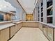Modern bar with white countertops and wooden cabinets at 111 S Pineapple Ave # 1009, Sarasota, FL 34236