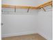 Spacious walk-in closet with built-in shelving at 111 S Pineapple Ave # 1009, Sarasota, FL 34236