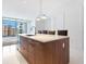 Modern kitchen with stainless steel appliances and an island at 111 S Pineapple Ave # 1009, Sarasota, FL 34236