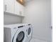 Laundry room with Whirlpool washer and dryer at 111 S Pineapple Ave # 1009, Sarasota, FL 34236