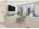Spacious living room with large TV and city views at 111 S Pineapple Ave # 1009, Sarasota, FL 34236