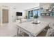Bright living room features an open floor plan, large windows, and city views at 111 S Pineapple Ave # 1009, Sarasota, FL 34236