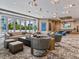 Spacious lounge with comfortable seating, large windows, and access to a patio at 111 S Pineapple Ave # 1009, Sarasota, FL 34236