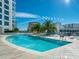 Inviting rooftop pool with plenty of lounge chairs at 111 S Pineapple Ave # 1009, Sarasota, FL 34236