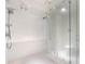 Large walk-in shower with marble tile and glass enclosure at 111 S Pineapple Ave # 1009, Sarasota, FL 34236