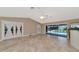 Open living space with pool view and access to backyard at 225 Brighton Ct, Englewood, FL 34223
