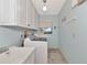 Laundry room with cabinets, sink, and washer/dryer hookups at 225 Brighton Ct, Englewood, FL 34223