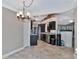 Bright dining area near kitchen with tile flooring at 225 Brighton Ct, Englewood, FL 34223