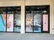 Modern nail salon storefront featuring inviting pink and blue decorations, stylish design at 225 Brighton Ct, Englewood, FL 34223
