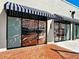 Attractive storefront with large windows displaying stylish interior design, inviting entrance at 225 Brighton Ct, Englewood, FL 34223
